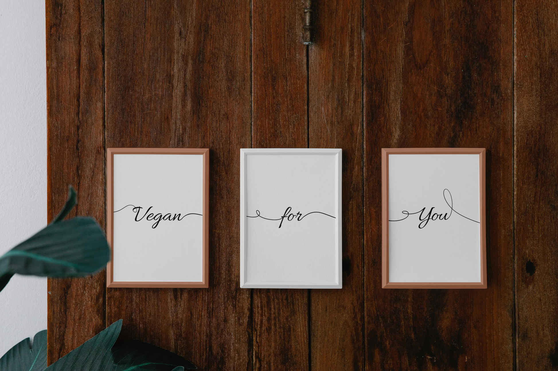 Three framed printable digital paintings in a row on a wooden wall, reading 'Vegan', 'for', 'You' in cursive font, with a modern home decor vibe.